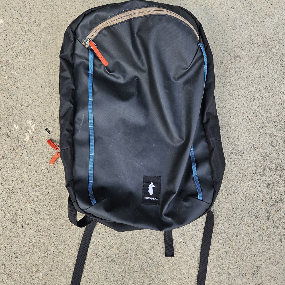 Cotopaxi Black Backpack with Blue and Red Details